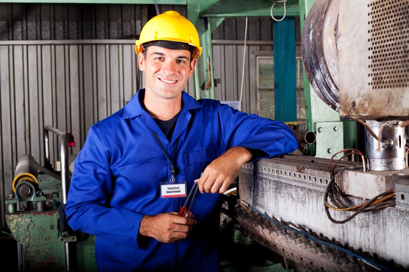 A person wearing a hard hat and blue jacketDescription automatically generated