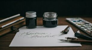 stylish calligraphy set in workspace