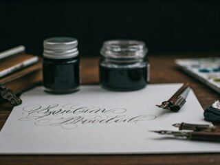 stylish calligraphy set in workspace