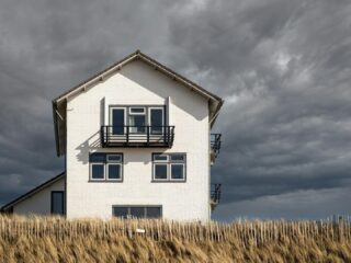 storm-resistant home design, resilient home construction, storm-proof house tips, hurricane resistant home design, flood-proof house solutions, climate resilient architecture, coastal home protection, home durability storm seasons, storm resilient building materials, home safety storm resilience